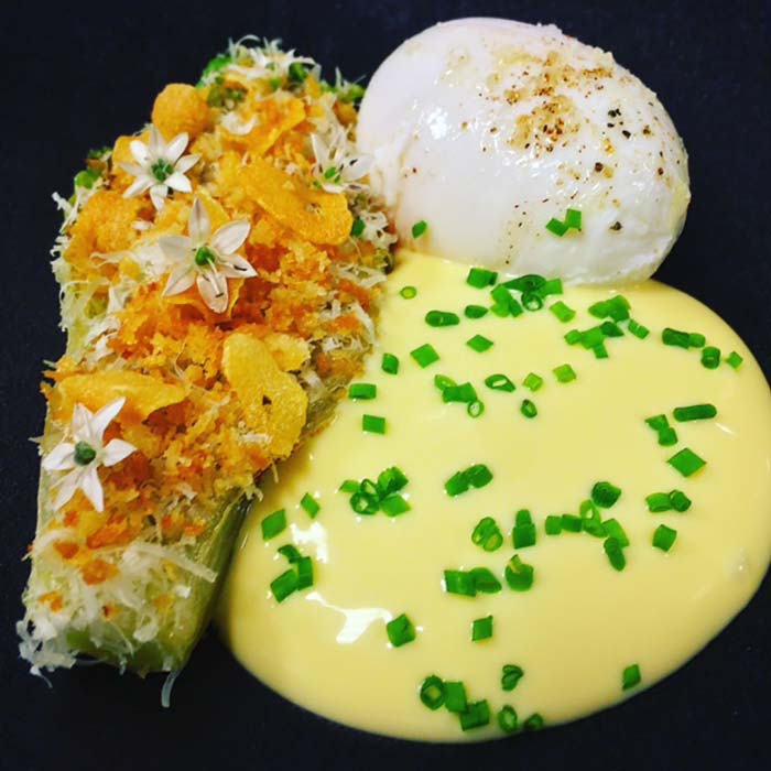 Caramlelised gem lettuce anchovy butter poached hen egg and hollandaise