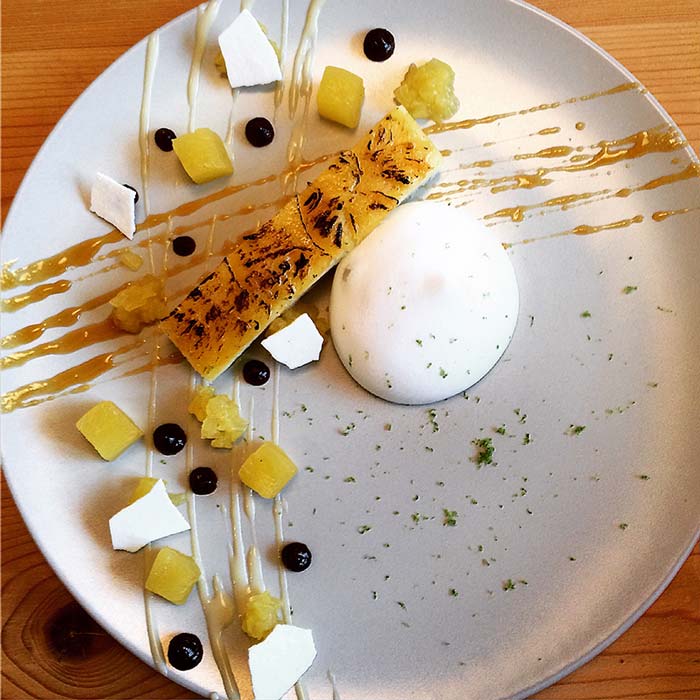 Pineapple upside down cake rum and raisin puree compressed pineapple and coconut espuma